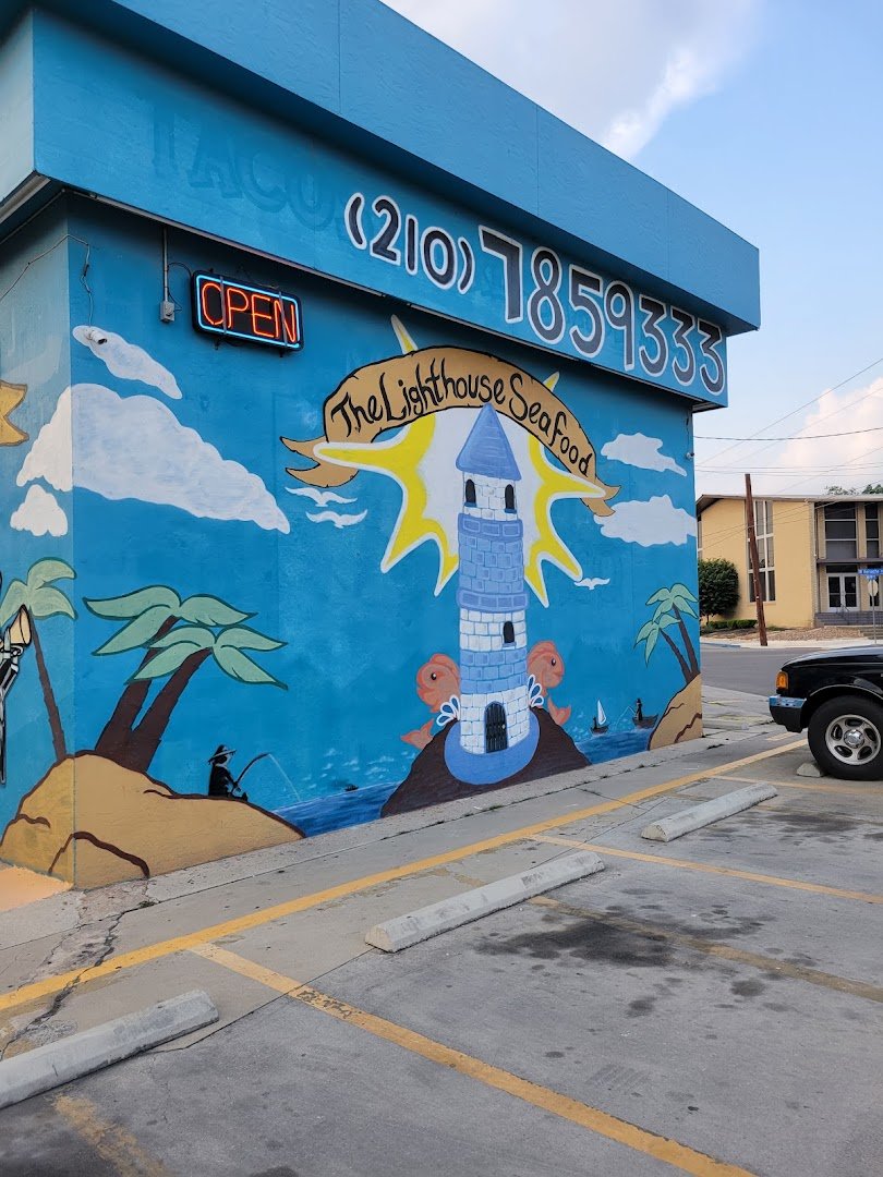 Seafood plates under ocean mural walls.