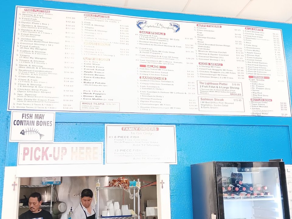 Seafood menu listing ceviche and clam chowder.
